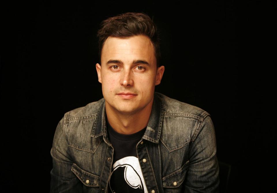 This April 4, 2013 photo shows guitarist Joe King from the band, The Fray, in New York. After listening to “Need a Girl By Friday,” King said that U2 frontman Bono told him in an email: “I need a song like this every Friday.” “It's just encouraging to get that kind of response from people you respect and look up to,” King said. His relationship with the band started a few years ago when The Fray opened up for U2 during their last tour. (AP Photo/John Carucci)