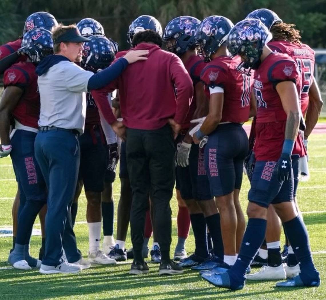 Drew Davis, assistant coach at St. Thomas University and son of former University of Miami and FIU football coach Butch Davis, talks to his players during a recent practice.