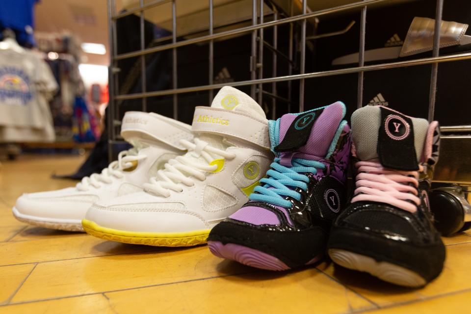 Samples of Yes! Athletics wrestling shoes are seen at Jock's Nitch at West Ridge Mall where the shoes are sold locally. Customers can also purchase the women-specific shoes online and at Jock's Nitch locations in Lenexa and Pittsburg.