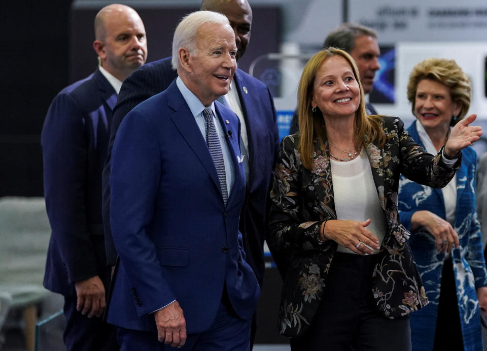 U.S. President Joe Biden listens to General Motors Chief Executive Mary Barra during a visit to the Detroit Auto Show to highlight electric vehicle manufacturing in America, in Detroit, Michigan, U.S., September 14, 2022. REUTERS/Kevin Lamarque