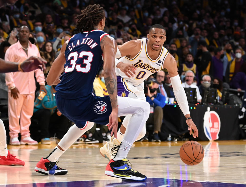 LOS ANGELES, CA - DECEMBER 25: Russell Westbrook #0 of the Los Angeles Lakers is defended by Nic Claxton #33 of the Brooklyn Nets as he drives to the basket in the second half of the game at Crypto.com Arena on December 25, 2021 in Los Angeles, California. NOTE TO USER: User expressly acknowledges and agrees that, by downloading and/or using this Photograph, user is consenting to the terms and conditions of the Getty Images License Agreement.   (Photo by Jayne Kamin-Oncea/Getty Images)