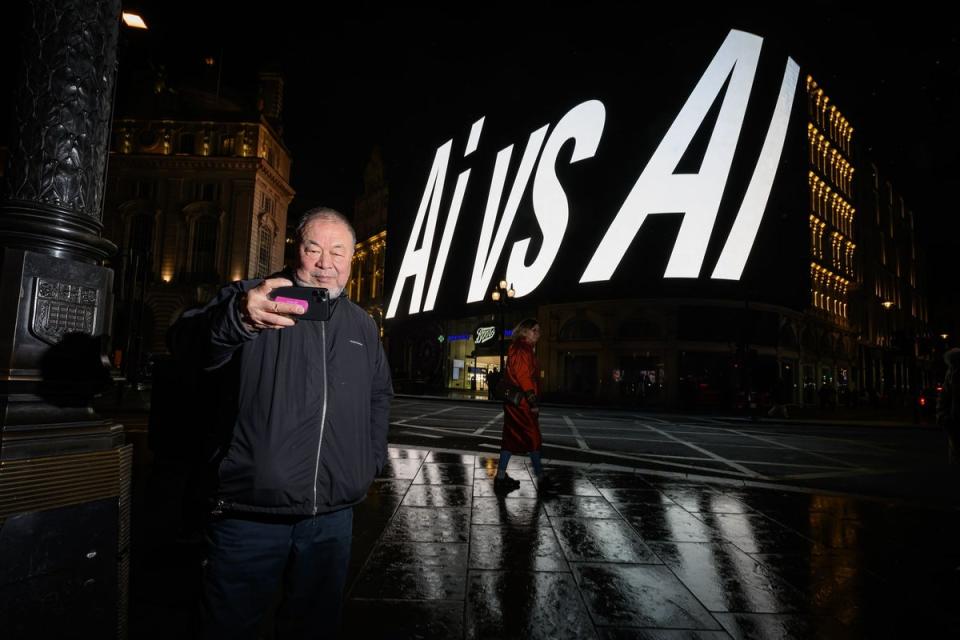 Ai Weiwei at the Ai vs AI artwork currently on at Piccadilly Lights (Getty Images)