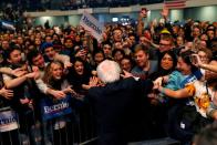 Democratic U.S. presidential candidate Senator Bernie Sanders greets supporters after speaking at a campaign rally in Cedar Rapids