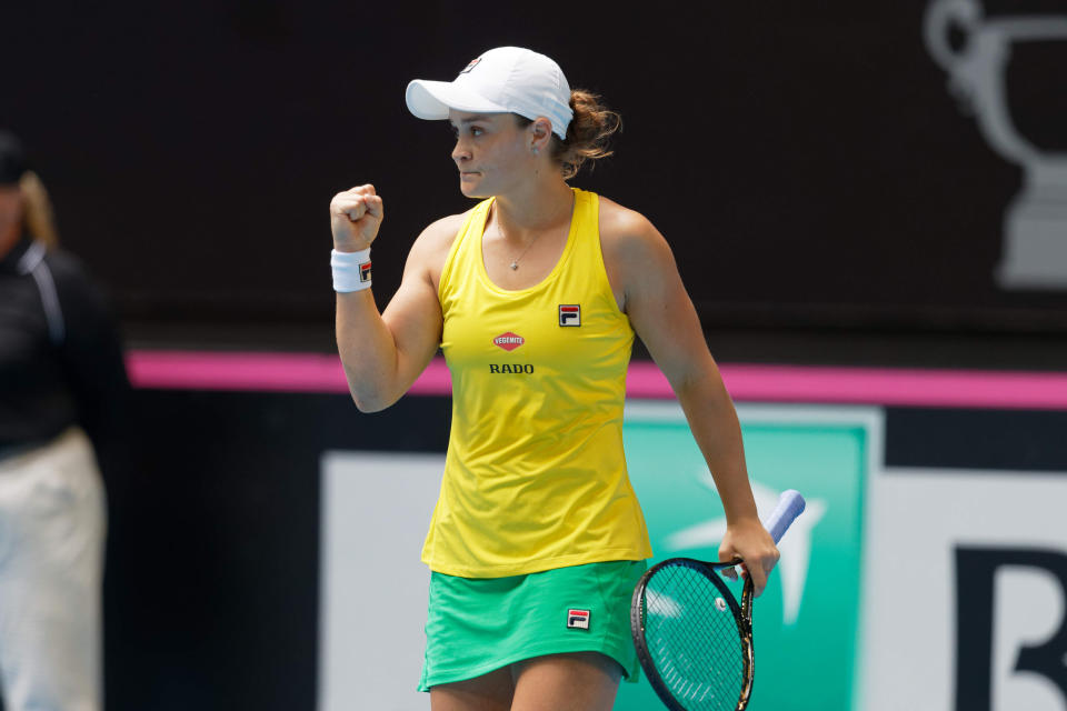 Australia's Ashleigh Barty celebrates defeating France's Caroline Garcia in their Fed Cup tennis final in Perth, Australia, Saturday, Nov. 9, 2019. (AP Photo/Trevor Collens)