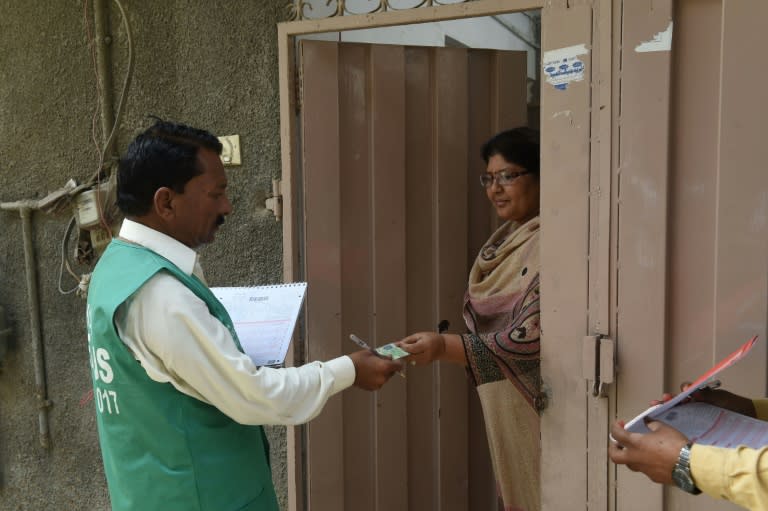 A census worker collects information from a Christian woman in Lahore's Youhanabad neighbourhood on March 28, 2017. Religious minorities hope Pakistan's first census since 1998 will be a step towards greater political representation and rights