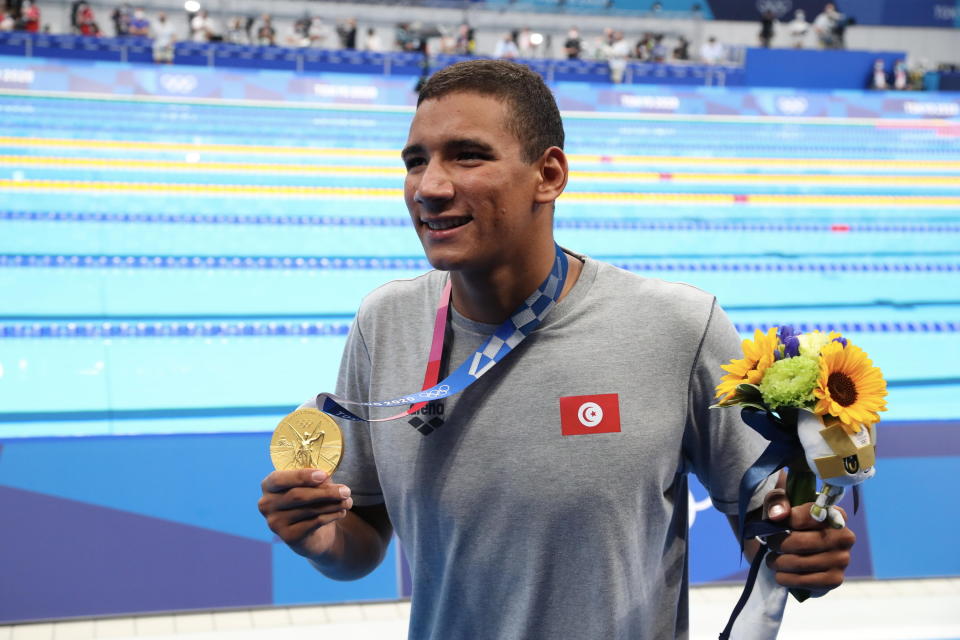 Ahmed Hafnaoui of Tunisia celebrates his gold medal in Men's 400m freestyle