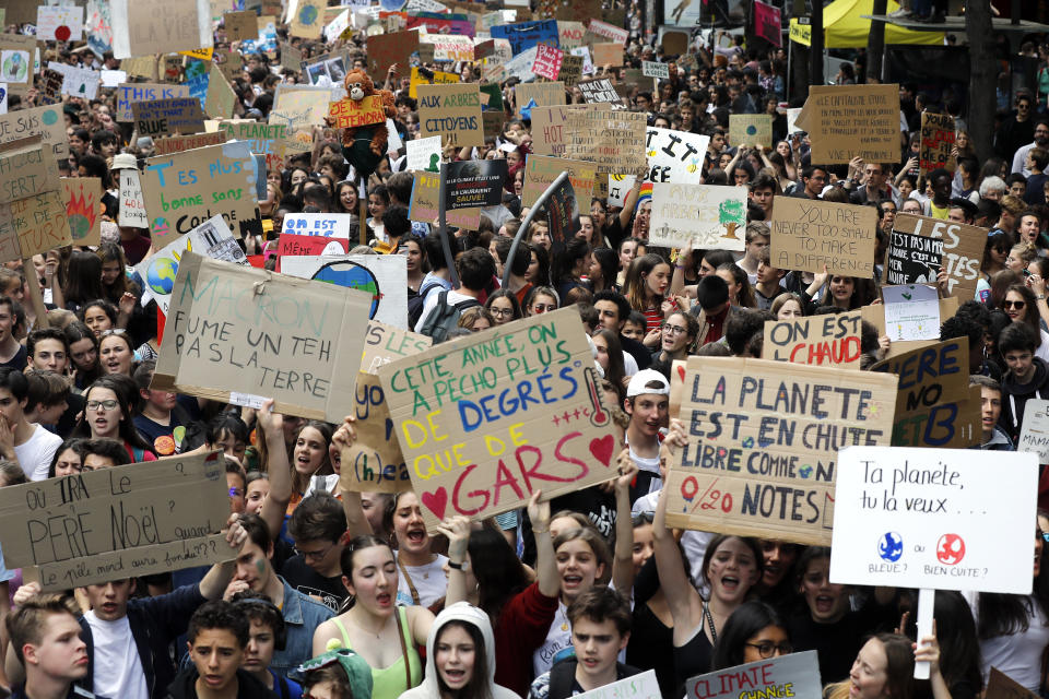 Youths take part to a climate march Friday, May 24, 2019 in front of the Opera house in Paris. Organizers expect more than one million young people to join protests over the world. (AP Photo/Michel Euler)