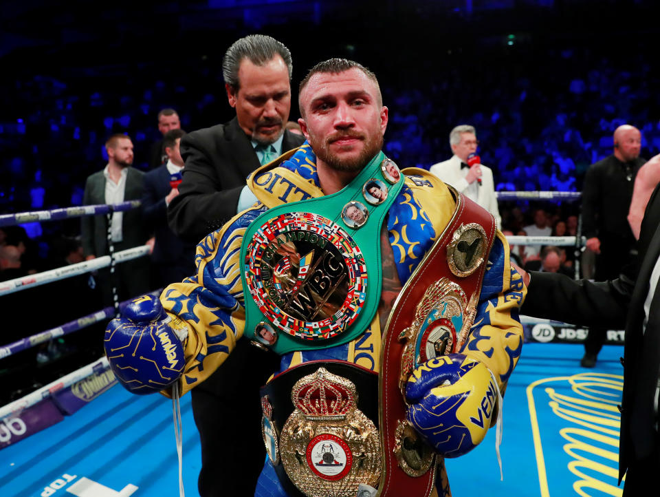 Boxing - Vasyl Lomachenko v Luke Campbell - WBO, WBA & WBC World Lightweight Titles - O2 Arena, London, Britain - August 31, 2019   Vasyl Lomachenko poses as he celebrates winning the fight   Action Images via Reuters/Andrew Couldridge