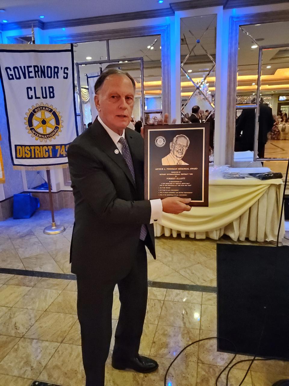 Forrest Elliott with a Rotary award.