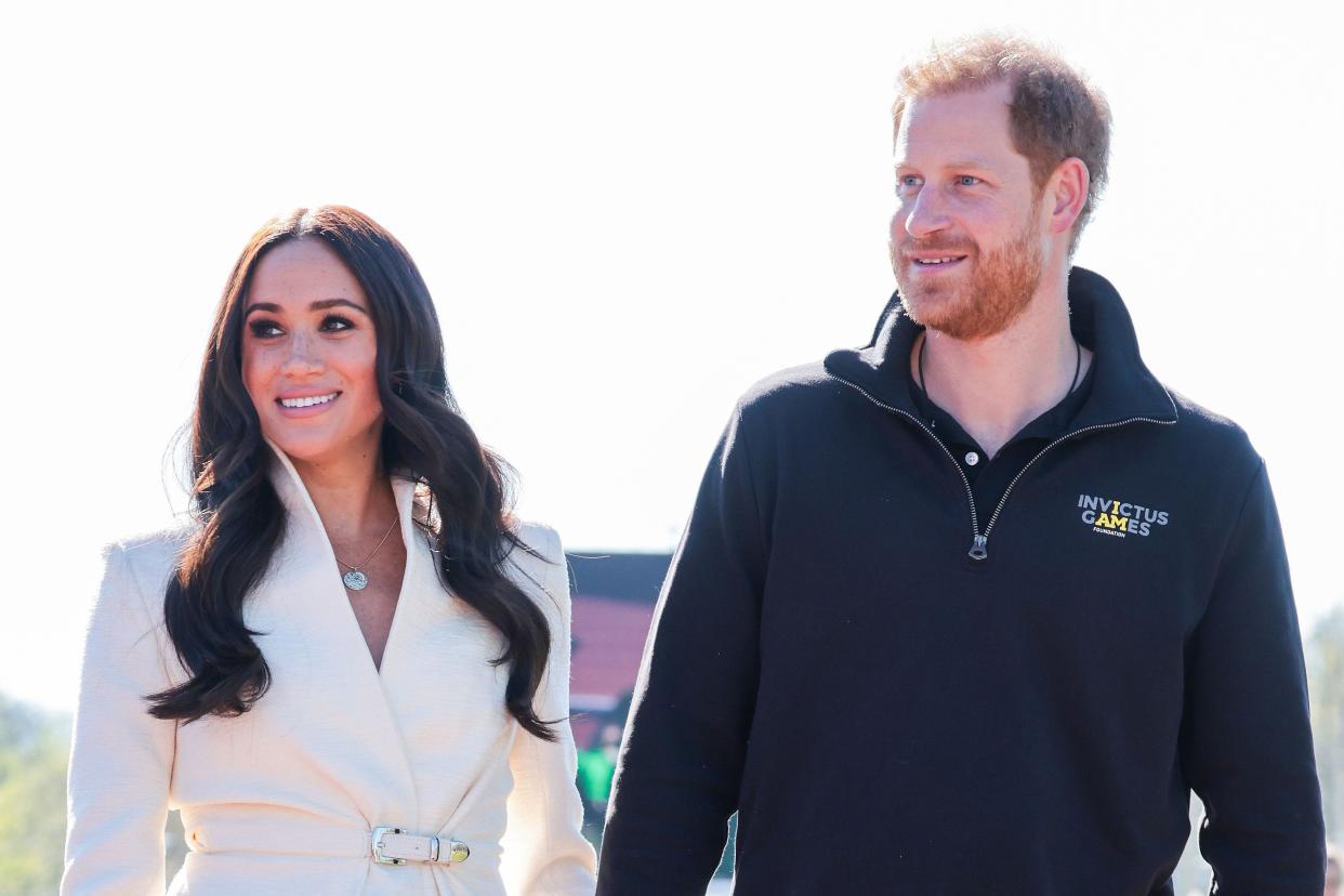 Prince Harry, Duke of Sussex and Meghan Markle, Duchess of Sussex attend the Athletics Competition during day two of the Invictus Games The Hague 2020 at Zuiderpark on April 17, 2022 in The Hague, Netherlands. (Getty Images for the Invictus Games Foundation)