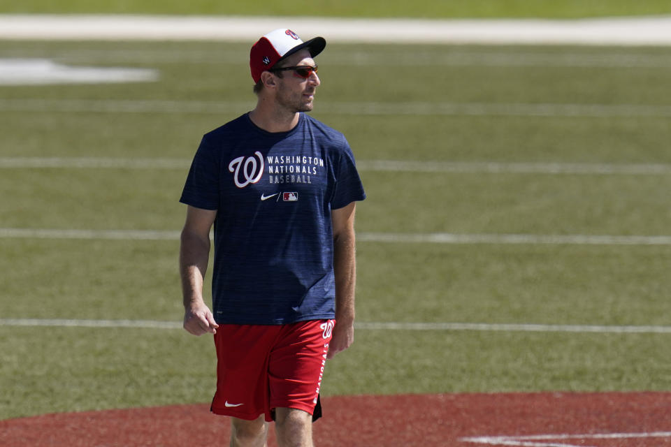 Washington Nationals pitcher Max Scherzer walks back to the clubhouse after spring training baseball practice Thursday, Feb. 25, 2021, in West Palm Beach, Fla. (AP Photo/Jeff Roberson)