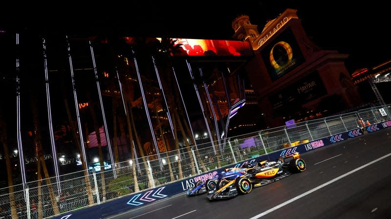 McLaren driver Oscar Piastri (81) of Australia races down the strip in front of the Cosmopolitan and the Bellagio Resort & Casino alongside Williams driver Alex Albon (23) of Thailand during the inaugural Formula 1 Heineken Silver Las Vegas Grand Prix on November 18, 2023 on the Las Vegas Street Circuit in Las Vegas, Nevada