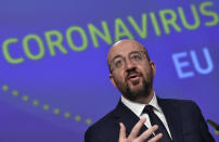 European Council President Charles Michel speaks during a media conference on the European Union response to the COVID-19 crisis at EU headquarters in Brussels, Wednesday, April 15, 2020. The European Union moved Wednesday to head off a chaotic and potentially disastrous easing of restrictions that are limiting the spread of the coronavirus, warning its 27 nations to move very cautiously as they return to normal life and base their actions on scientific advice. (John Thys, Pool Photo via AP)