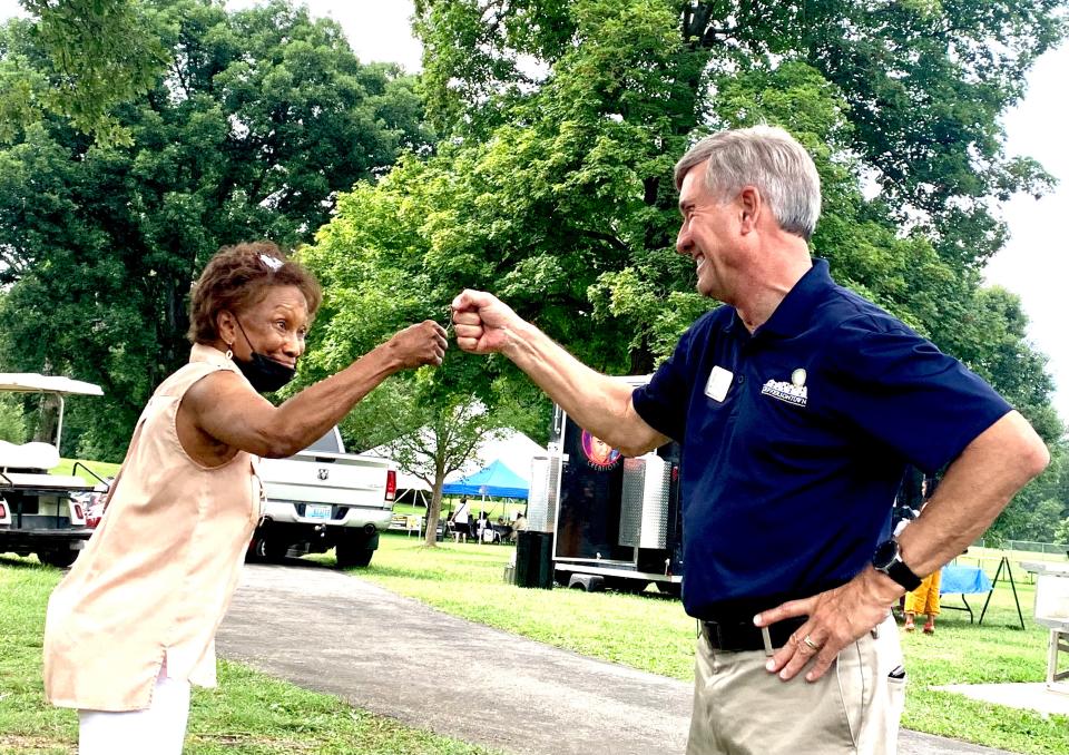 Jeffersontown Mayor Bill Dieruf, who is running for Louisville mayor as the Republican nominee, greets one of the attendees at a Shawnee Park celebration this summer.