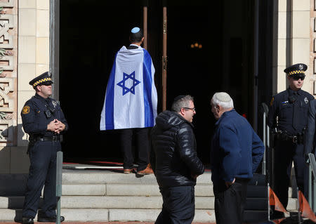 Police stand at the entrance to Rodef Shalom Temple before funeral services for brothers Cecil and David Rosenthal, victims of the Tree of Life Synagogue shooting, in Pittsburgh, Pennsylvania, U.S., October 30, 2018. REUTERS/Cathal McNaughton