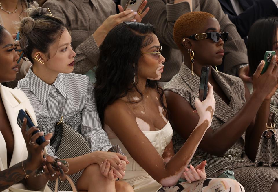 Winnie Harlow, center, and Lashana Lynch are seen during Paris Fashion Week on July 7, 2022.