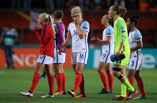 Millie Bright, centre, appears dejected after the final whistle against the Netherlands at Euro 2017