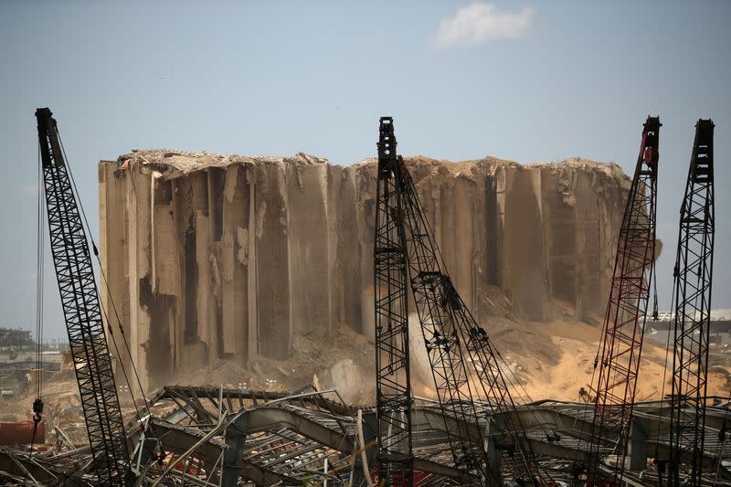 Debris are seen in the port area after a blast in Beirut