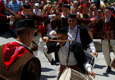 People dressed in folk costumes take part in a traditional wedding ceremony in the village of Galicnik, west of capital Skopje, Macedonia July 15, 2018. REUTERS/Ognen Teofilovski