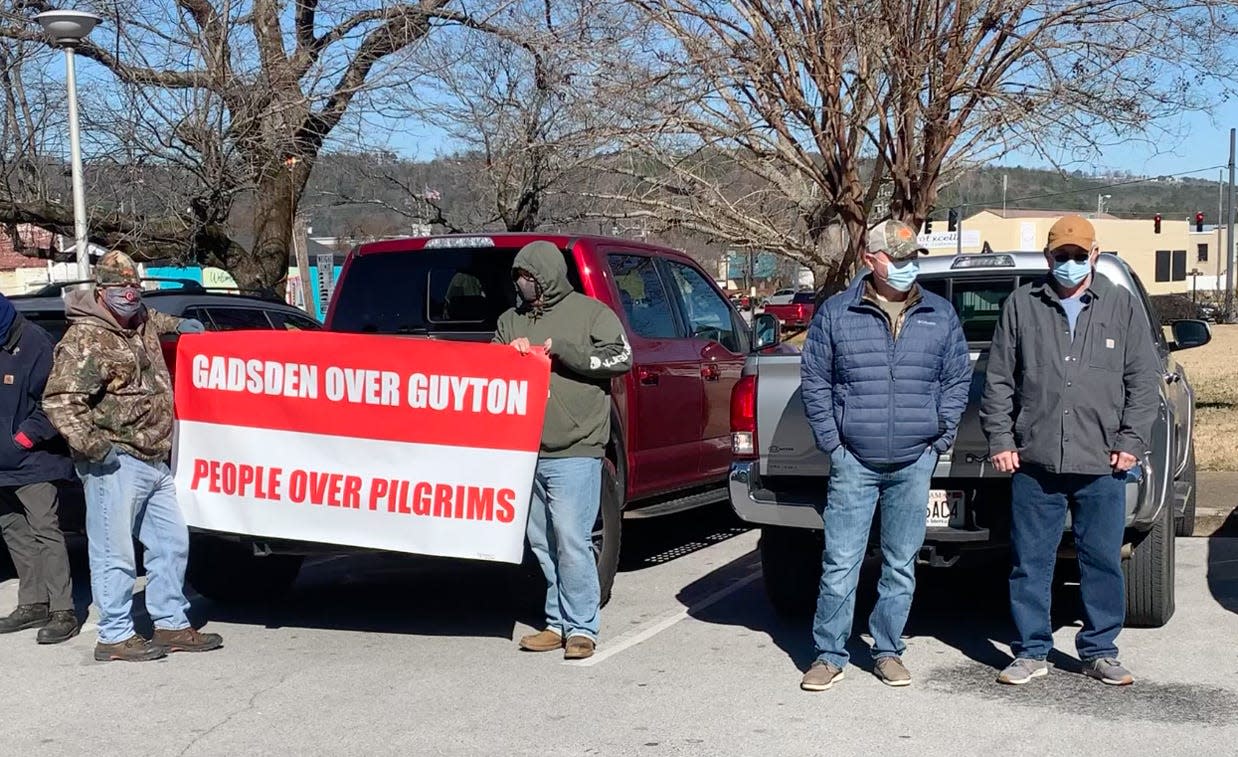 Opponents of a proposed rendering plant in Gadsden braved the cold and wind on Tuesday outside City Hall, as the Gadsden City Council discussed the issue inside.