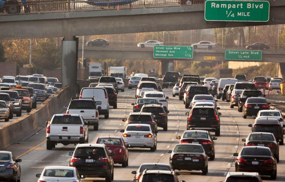 Traffic moves on the Hollywood Freeway in Los Angeles. Nearly two dozen states and several cities are challenging the Trump administration's rollback of Obama-era mileage standards, saying science backed up the old regulations developed with the help of the nation's car makers. They asked the U.S. Court of Appeals for the District of Columbia Circuit on Wednesday, May 27, 2020, to review the actions of government agencies that led to the new rule being issued in March.