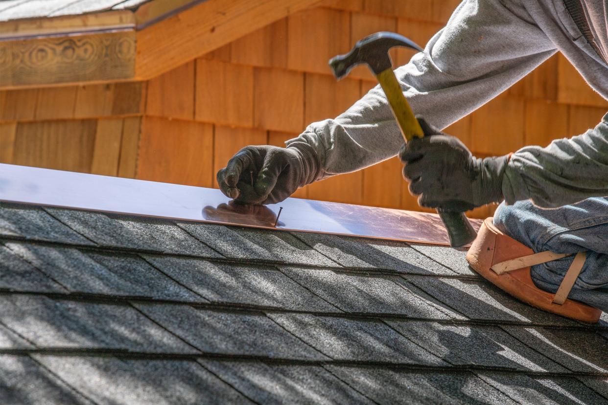 Man repairing a roof