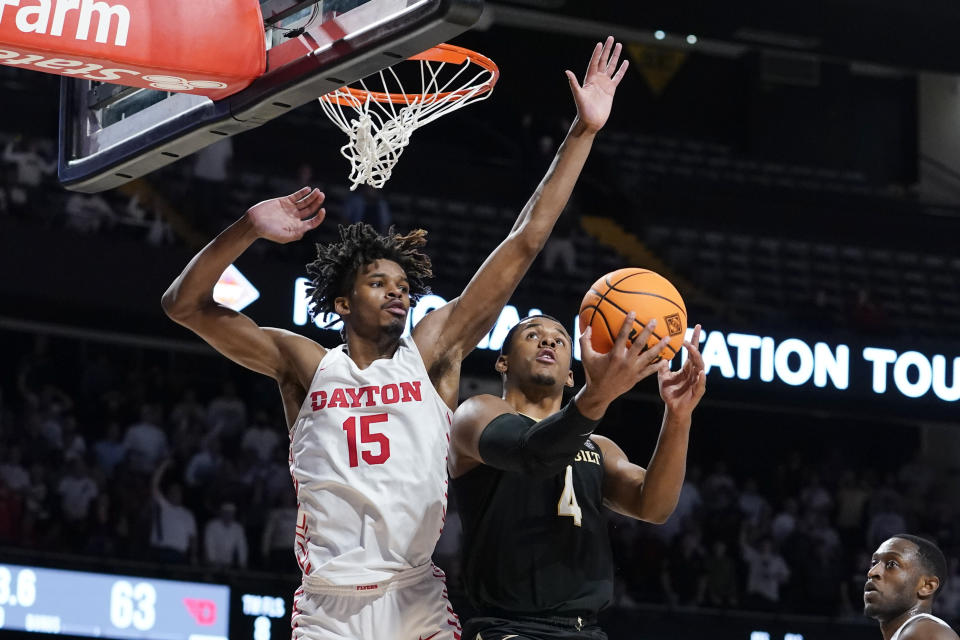 FILE -Dayton's DaRon Holmes II (15) blocks a shot by Vanderbilt's Jordan Wright (4) in an NCAA college basketball game in the second round of the NIT Sunday, March 20, 2022, in Nashville, Tenn. Dayton is ranked in the preseason AP Top 25 for just the third time in program history. The Flyers return all five starters from last season, including 2022 Atlantic 10 rookie of the year DaRon Holmes II. (AP Photo/Mark Humphrey, File)