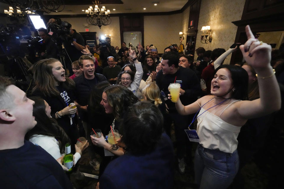 People cheer as election results come in during an election night campaign event for Sen. Maggie Hassan, D-N.H., Tuesday, Nov. 8, 2022, in Manchester, N.H. (AP Photo/Charles Krupa)