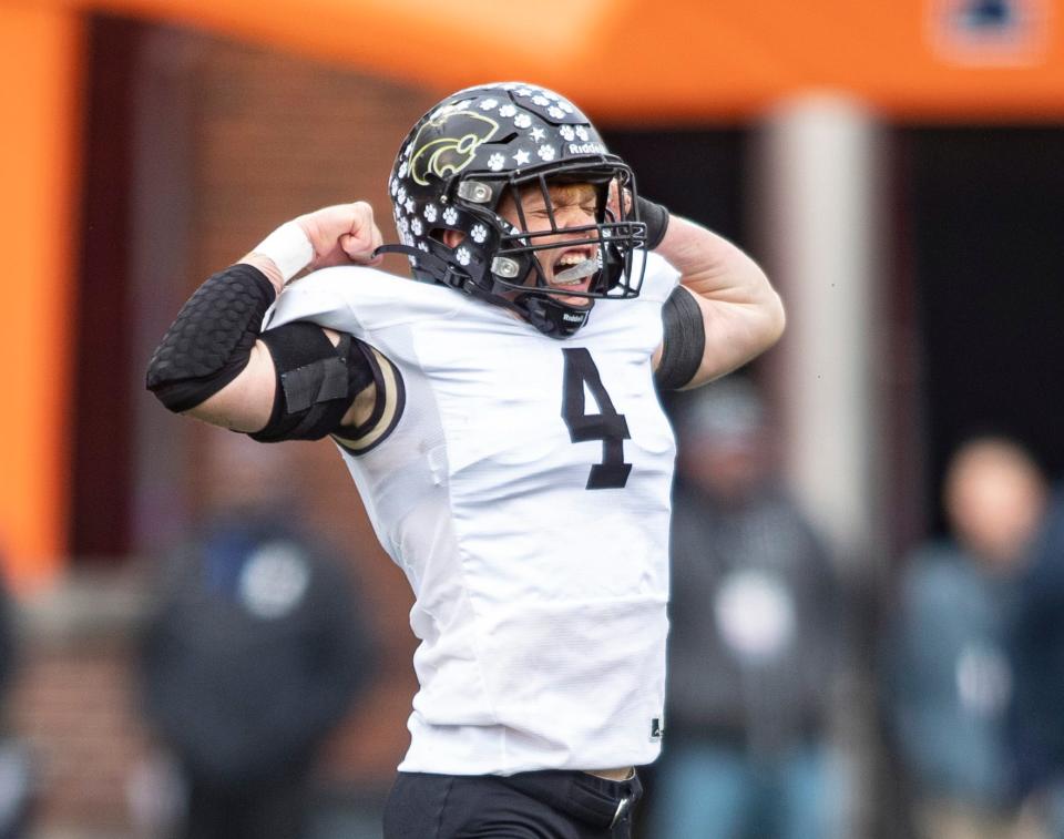 Lena-Winslow's Gage Dunker celebrates an interception against Camp Point Central  on Friday, Nov. 25, 2022, at University of Illinois in Champaign.