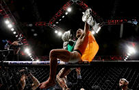 <p>This was the year of McGregor. McGregor, who started the year as featherweight champ, split a pair of welterweight fights with Nate Diaz, then became the first simultaneous two-weight champ in UFC history with his second-round TKO of Eddie Alvarez to claim the lightweight belt at UFC 205 in Madison Square Garden. (Photo by Michael Reaves/Getty Images) </p>