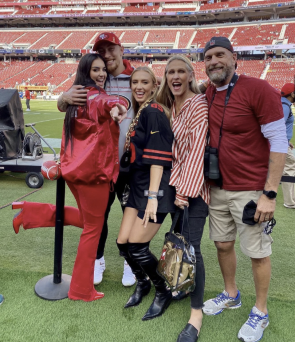 <p>If MVP trophies were awarded for fabulous style, Claire Kittle would definitely deserve one! She's dressed head-to-toe in red to support her husband George Kittle. And just look at that rhinestone football purse she's sporting—it's a total touchdown!</p>