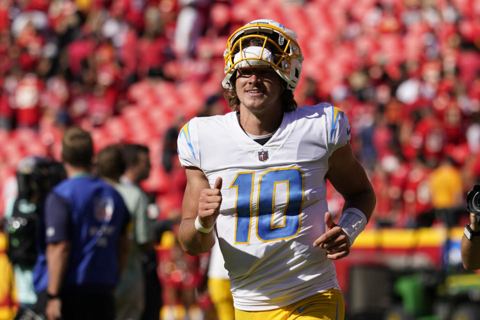 Los Angeles Chargers quarterback Justin Herbert (10) runs off the field following an NFL football game against the Kansas City Chiefs, Sunday, Sept. 26, 2021, in Kansas City, Mo. Los Angeles won 30-24. (AP Photo/Ed Zurga)