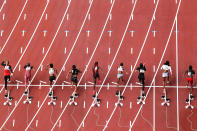 <p>TOPSHOT - Athletes compete in the women's 100m heats during the Tokyo 2020 Olympic Games at the Olympic Stadium in Tokyo on July 30, 2021. (Photo by Antonin THUILLIER / AFP) (Photo by ANTONIN THUILLIER/AFP via Getty Images)</p> 