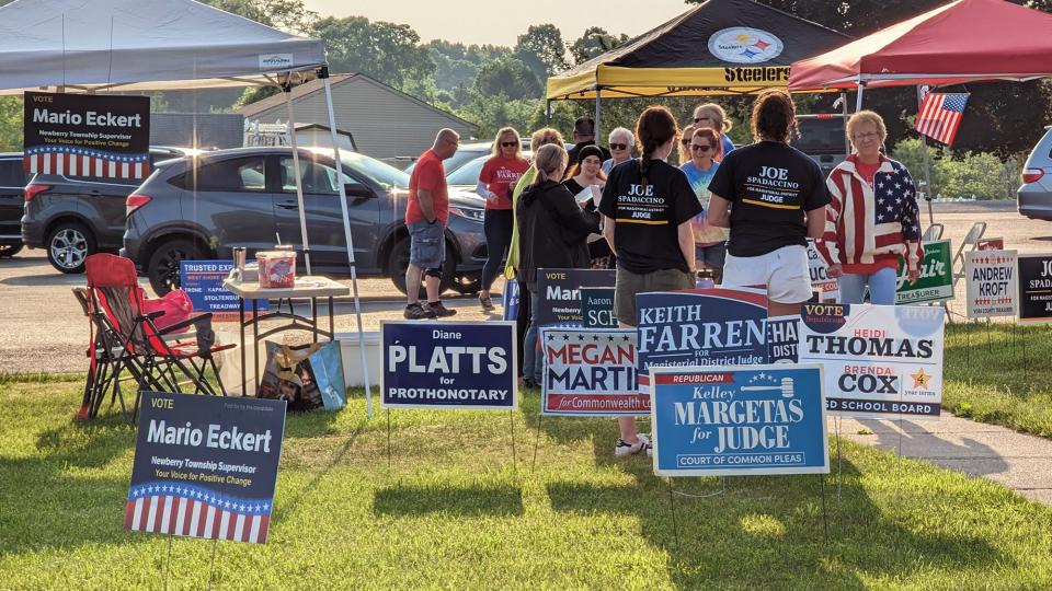 Voters are met with a gauntlet of candidate supporters at the Newberry Township polling place #1 during the first hour of voting on Election Day at Paddletown St. Paul's United Methodist Church.