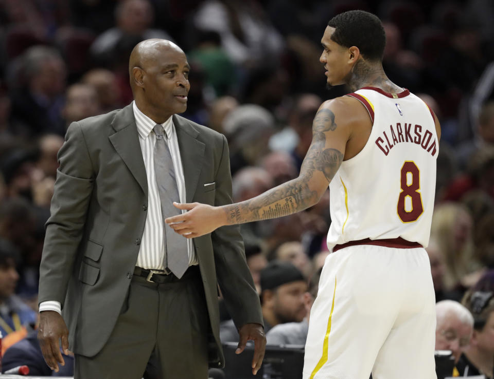 Cleveland Cavaliers acting head coach Larry Drew talks with Jordan Clarkson in the second half of an NBA basketball game against the Atlanta Hawks, Tuesday, Oct. 30, 2018, in Cleveland. The Cavaliers won 136-114. (AP Photo/Tony Dejak)