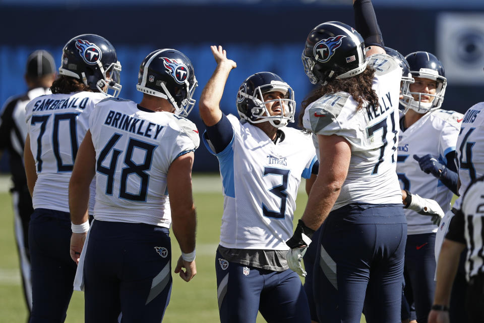 Tennessee Titans kicker Stephen Gostkowski (3) celebrates with Dennis Kelly (71) after kicking a 49-yard field goal against the Jacksonville Jaguars in the second half of an NFL football game Sunday, Sept. 20, 2020, in Nashville, Tenn. (AP Photo/Wade Payne)