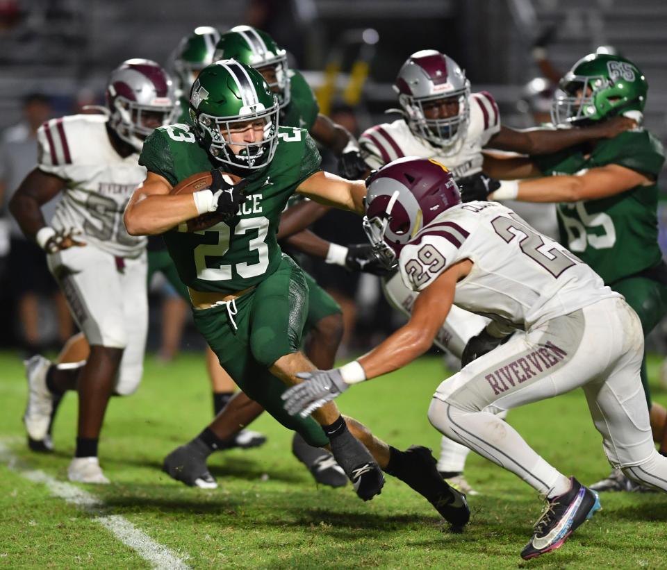 Venice High's Griffin Gisotti (#23) tries to avoid Riverview defensive back Andon Clough (#29). The Venice Indians hosted the Riverview Rams Friday evening, Sept. 29, 2023.