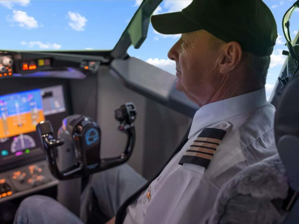 Former recreational pilot Bob Roberts set up a flight simulator of a Boeing 737 MAX aircraft in his backyard in Camrose, Alta.  (Bob Roberts/Meghan and Nicole Films - image credit)