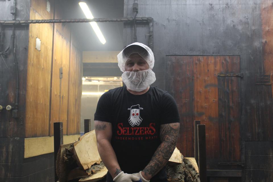 Ben Boger is one of multiple smoke masters who help keep the fires burning 24 hours a day. He has worked at Seltzer's Smokehouse Meats for 14 years.