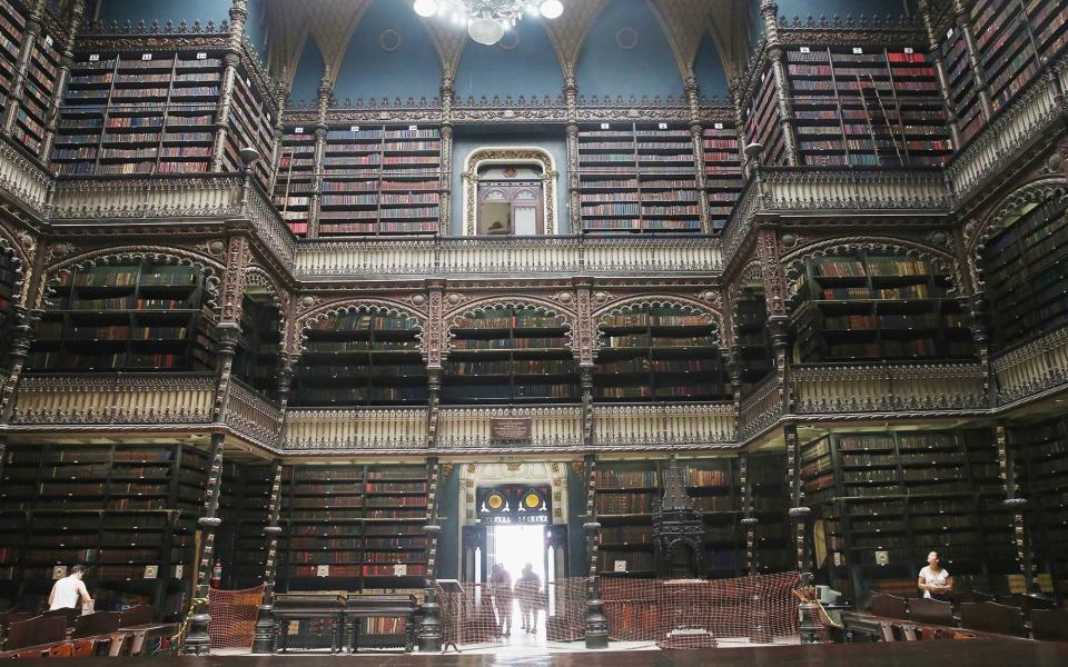 <p>The Portuguese Royal Reading Room should be on any book lover’s must-visit list. Each book housed in the cathedral-like library is written in Portuguese, but that shouldn’t stop you from marveling at the massive amount of texts lining the three-story walls. It does house the largest collection of Portuguese works outside of Portugal after all. Additionally, you’ll find a number of interesting artifacts like statues, maps, and medallions as you explore. Oh, and did we mention it’s free? </p>