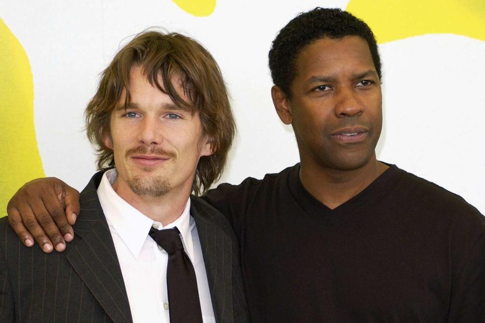 <p>J. Vespa/WireImage</p> Ethan Hawke and Denzel Washington in Venice Lido, Italy, in 2001