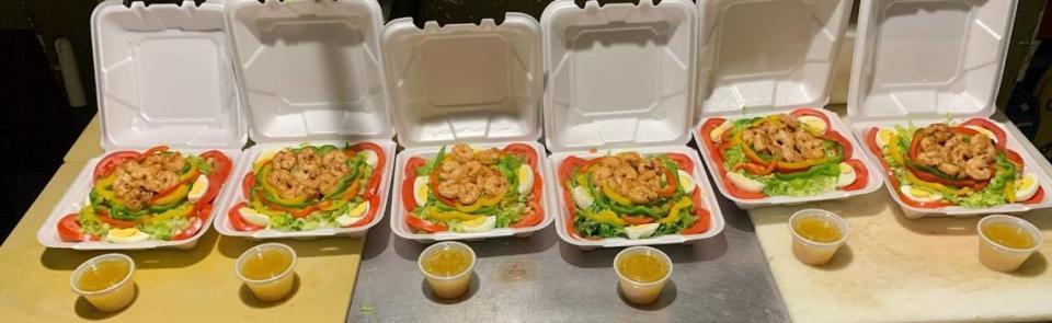 Rodney’s Jamaican Grill shrimp salads are lined up and ready to go for hungry customers.