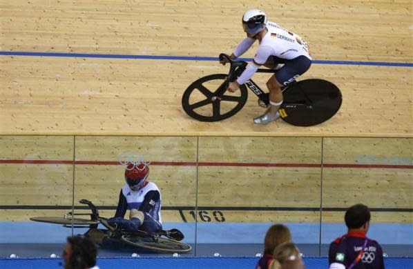 German-born Philip Hindes said he deliberately crashed after making a poor start in the heats of the Olympic track cycling team sprint, an event in which he and fellow Britons Chris Hoy and Jason Kenny went on to win gold. Britain's Philip Hindes (L) sits on the ground after falling during their track cycling men's team sprint qualifying heats at the Velodrome during the London 2012 Olympic Games August 2, 2012.