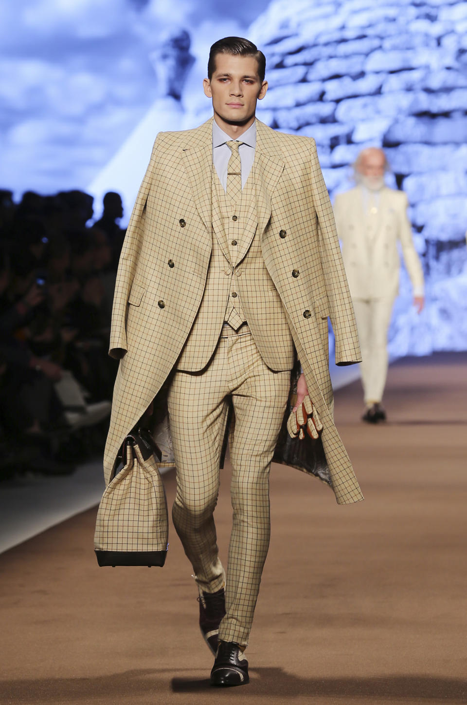 A model wears a creation for Etro men's Fall-Winter 2014 collection, part of the Milan Fashion Week, unveiled in Milan, Italy, Monday, Jan. 13, 2014. (AP Photo/Antonio Calanni)