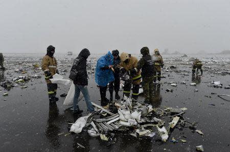 Emergencies Ministry members and investigators work at the crash site of the Boeing 737-800 Flight FZ981 operated by Dubai-based budget carrier Flydubai, at the airport of Rostov-On-Don, Russia, in this handout image released by the Russian Emergencies Ministry on March 19, 2016. REUTERS/Russian Emergencies Ministry/Handout via Reuters