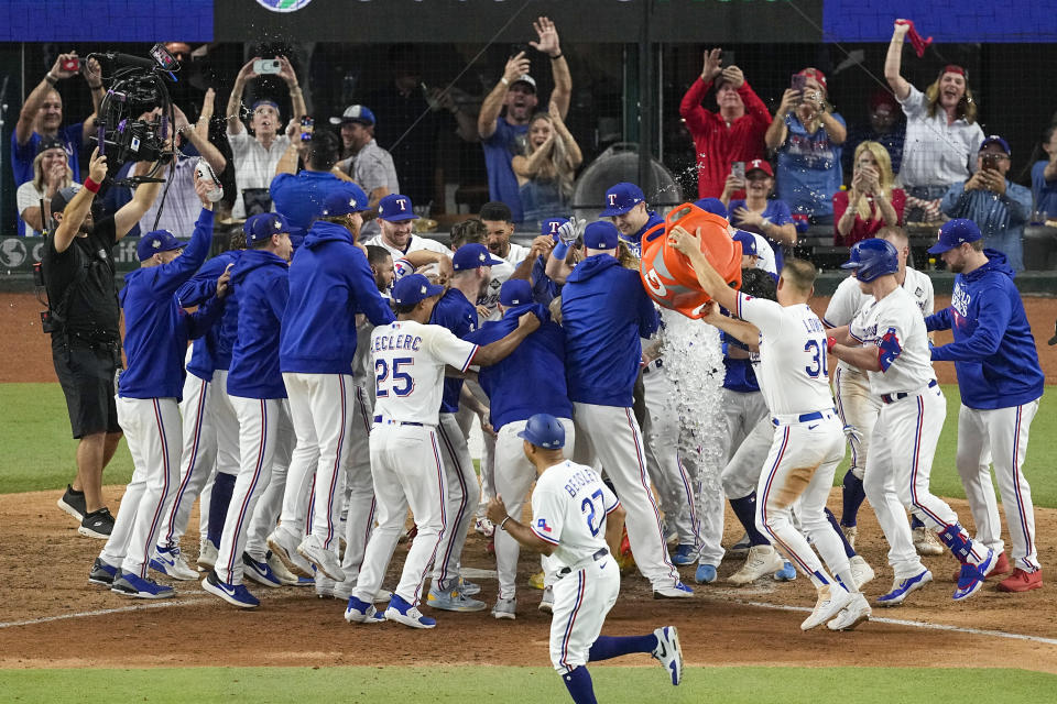 Texas Rangers' Adolis Garcia celebrates after hitting a game-winning home run against the Arizona Diamondbacks during the 11th inning in Game 1 of the baseball World Series Friday, Oct. 27, 2023, in Arlington, Texas. The Rangers won 6-5.(AP Photo/Tony Gutierrez)