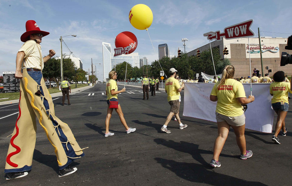 Demonstrators march in a Labor Day parade, Monday, Sept. 3, 2012, in Charlotte, N.C. Demonstrators are protesting before the start of the Democratic National Convention. (AP Photo/Gerry Broome)