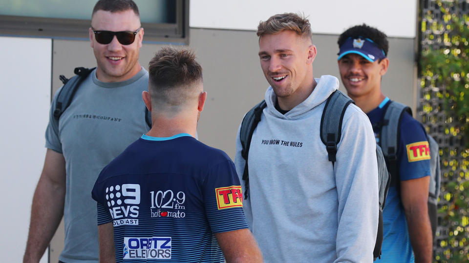 Bryce Cartwright, pictured here talking to Gold Coast Titans teammates at training. 