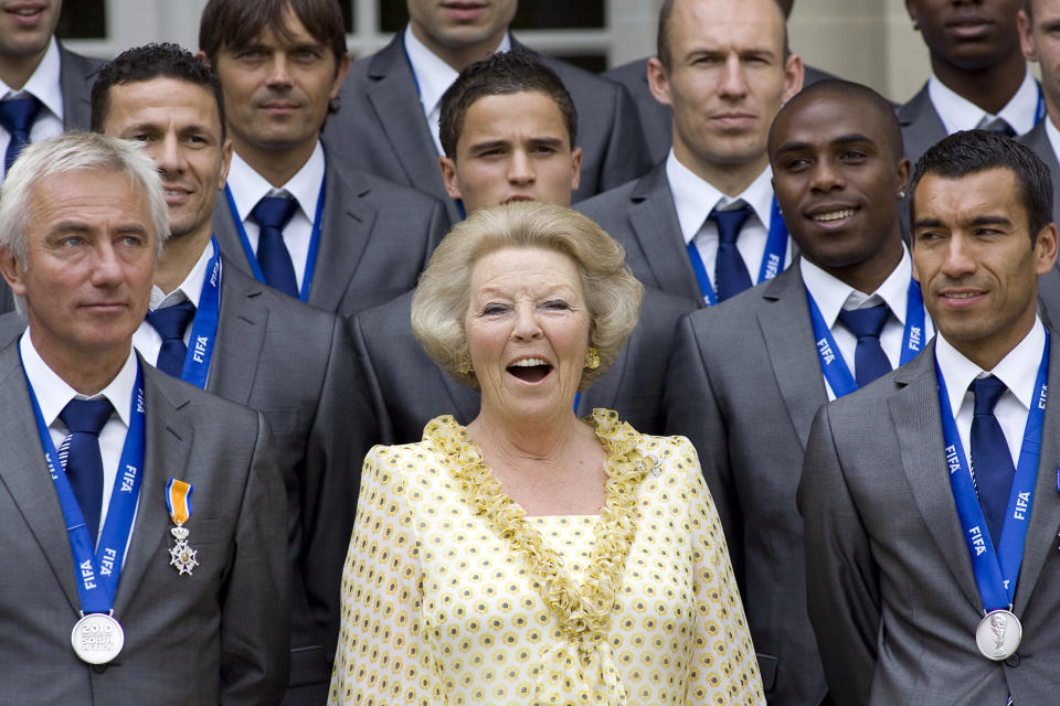 FILE- In this Tuesday, July 13, 2010 file photo, The Netherlands' World Cup team poses with Queen Beatrix, center, at Noordeinde Palace in The Hague, Netherlands, during a day of celebrations for the tournament runners-up. The Dutch Royal House says Queen Beatrix will deliver a nationally televised speech, on Monday, Jan. 28, 2013, and speculation is growing that the popular monarch will announce she is to abdicate. Beatrix, who turns 75 on Thursday, has ruled this nation of 16 million for more than 32 years and would be succeeded by her eldest son, Crown Prince Willem-Alexander. (AP Photo/Rob Keeris, File)