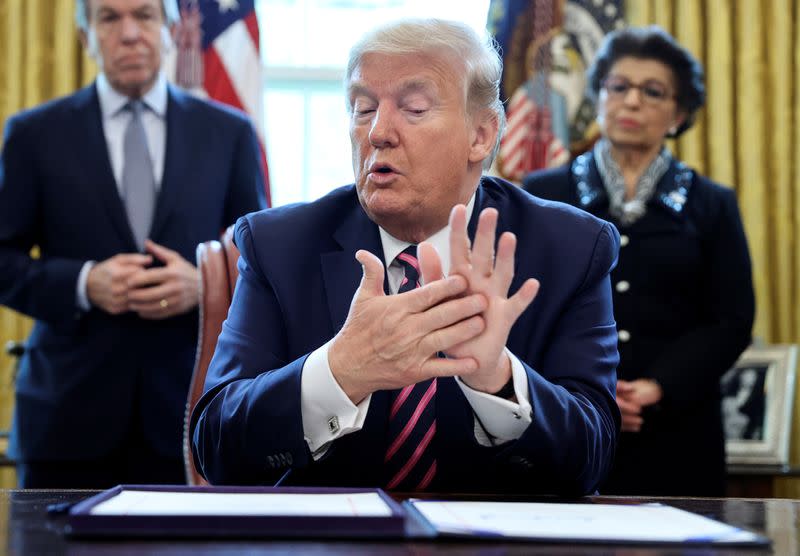 U.S. President Trump participates in coronavirus relief bill signing ceremony at the White House in Washington